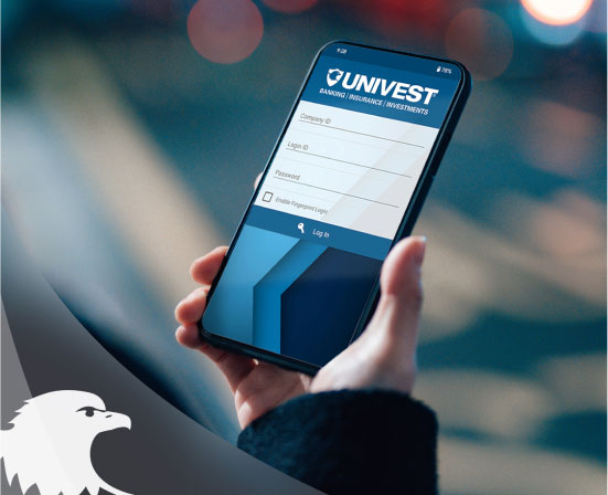 Person holds a phone with the Univest app open on the screen.